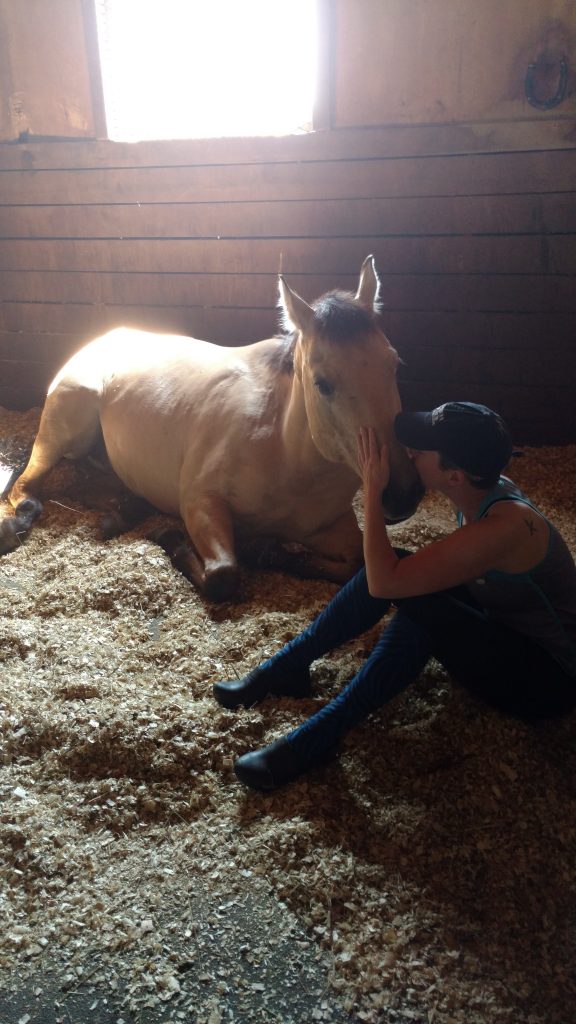 Karli sitting with a horse