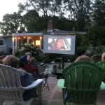 Poolside movie night with social distanced lawn chairs