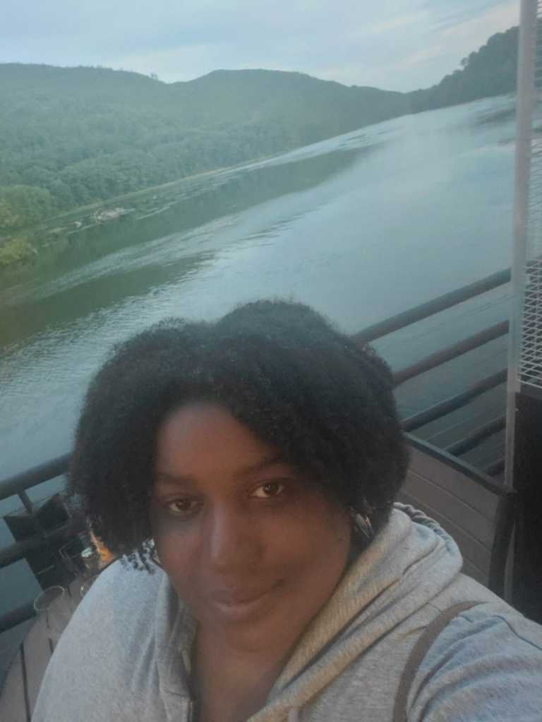 selfie of Sametra by a river in summer